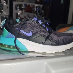  Nike Air Max Motion 2 running shoes in black and purple with teal accents. 
